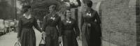 A historical 1960's image of four Columbia Nursing students walking on the sidewalk in Washington Heights.